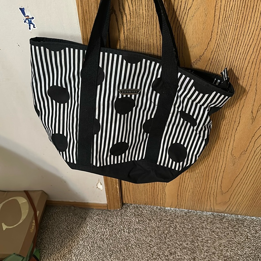 Black and white striped and polka dot prodigy bag.